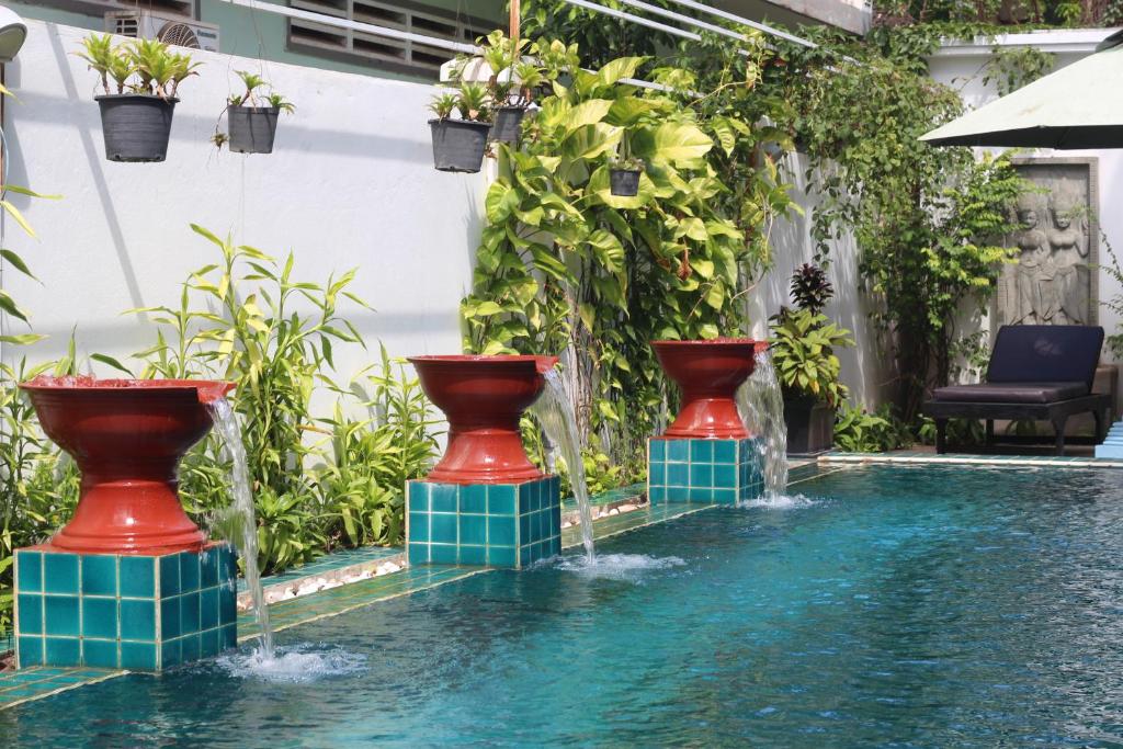 Pool with decorative water fountains